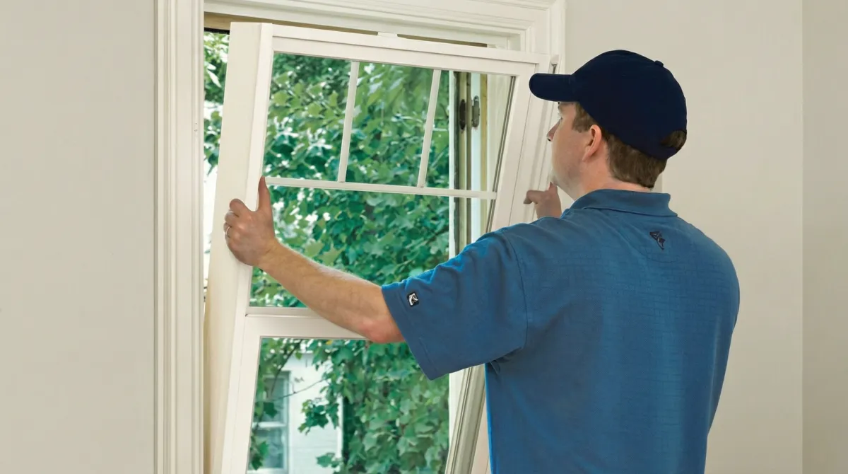 Professional contractors performing a residential window insulation and replacement service in Tallahassee, FL